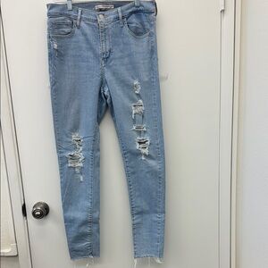 Levi's 720 High Rise Super Skinny Jeans Size 29 with Distressed Detailing